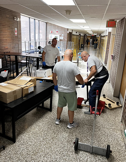 Custodial staff working in the school lobby