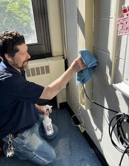 Custodial staff cleaning wires